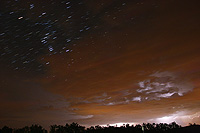 startrails orion and thunderstorm